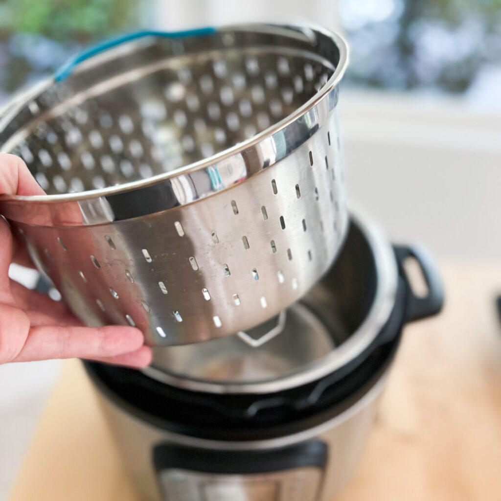 Steamer basket in front of an Instant Pot