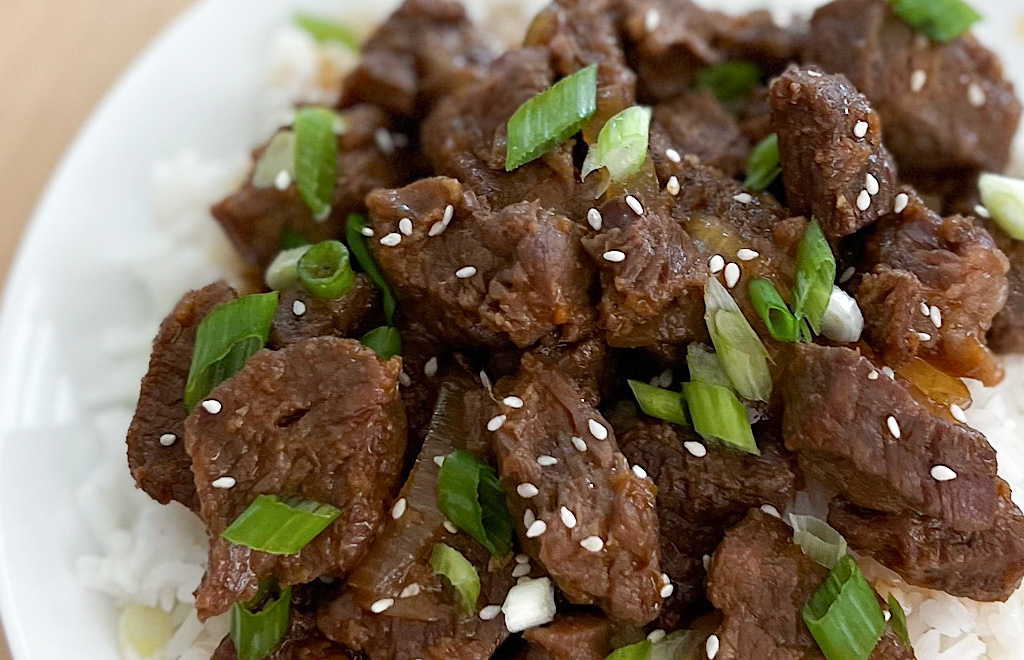 Korean Beef with green onion and sesame seeds over rice
