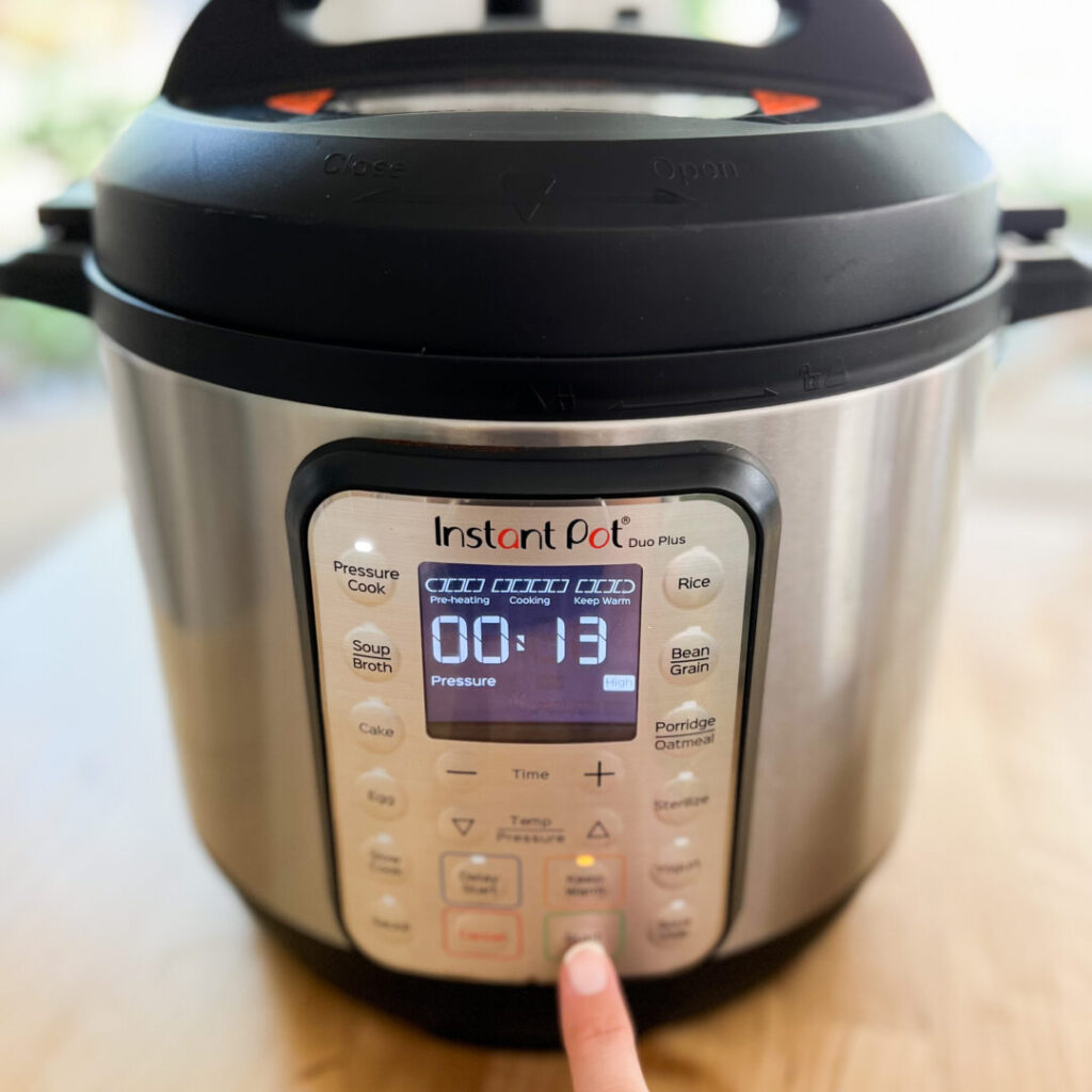 Pressure cooker set to 13 minutes