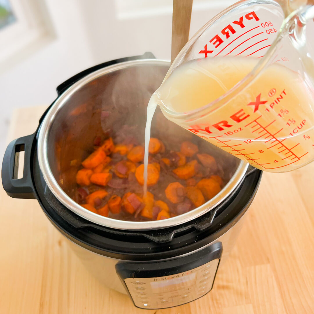 Pouring chicken broth into an Instant Pot