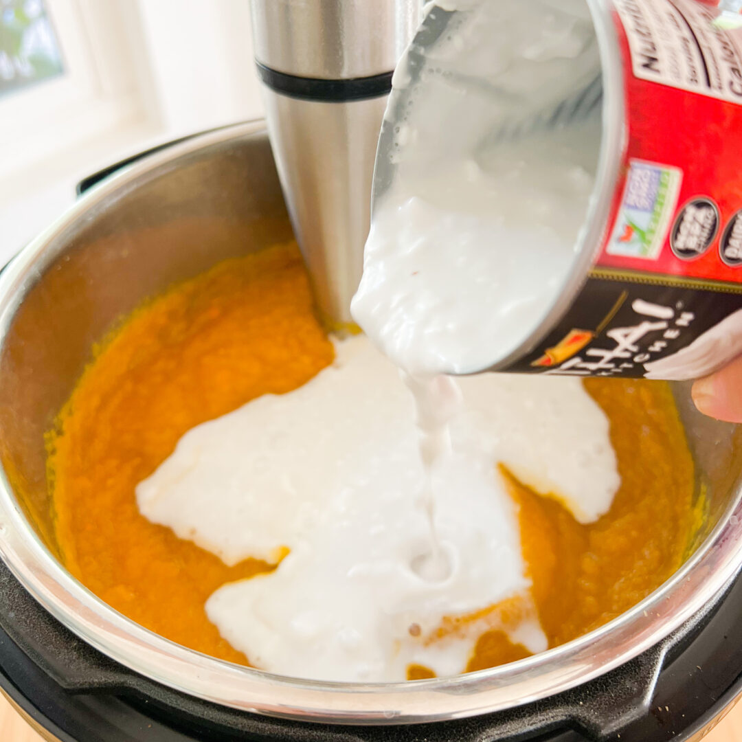 Coconut cream being poured in an Instant Pot for butternut squash soup