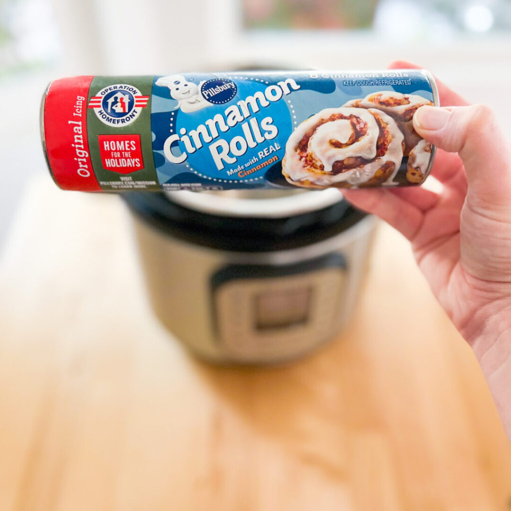 Canned cinnamon rolls in front of an Instant Pot