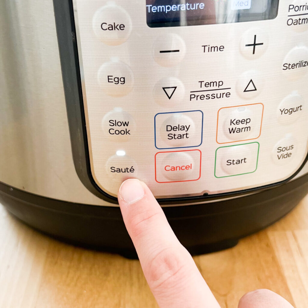 Pressing saute on an Instant Pot.