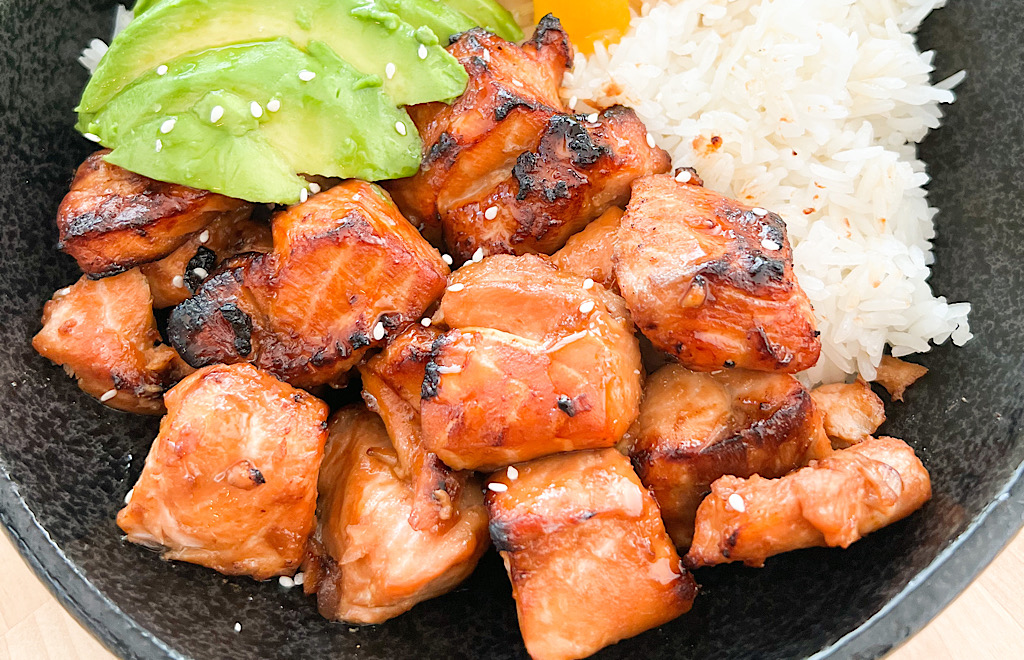 Air Fryer Salmon Bites in a bowl with rice, avocado and mango.