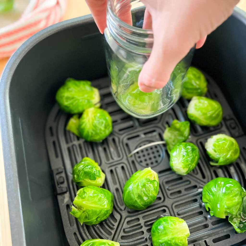 Smashing brussel sprouts with a mason jar.