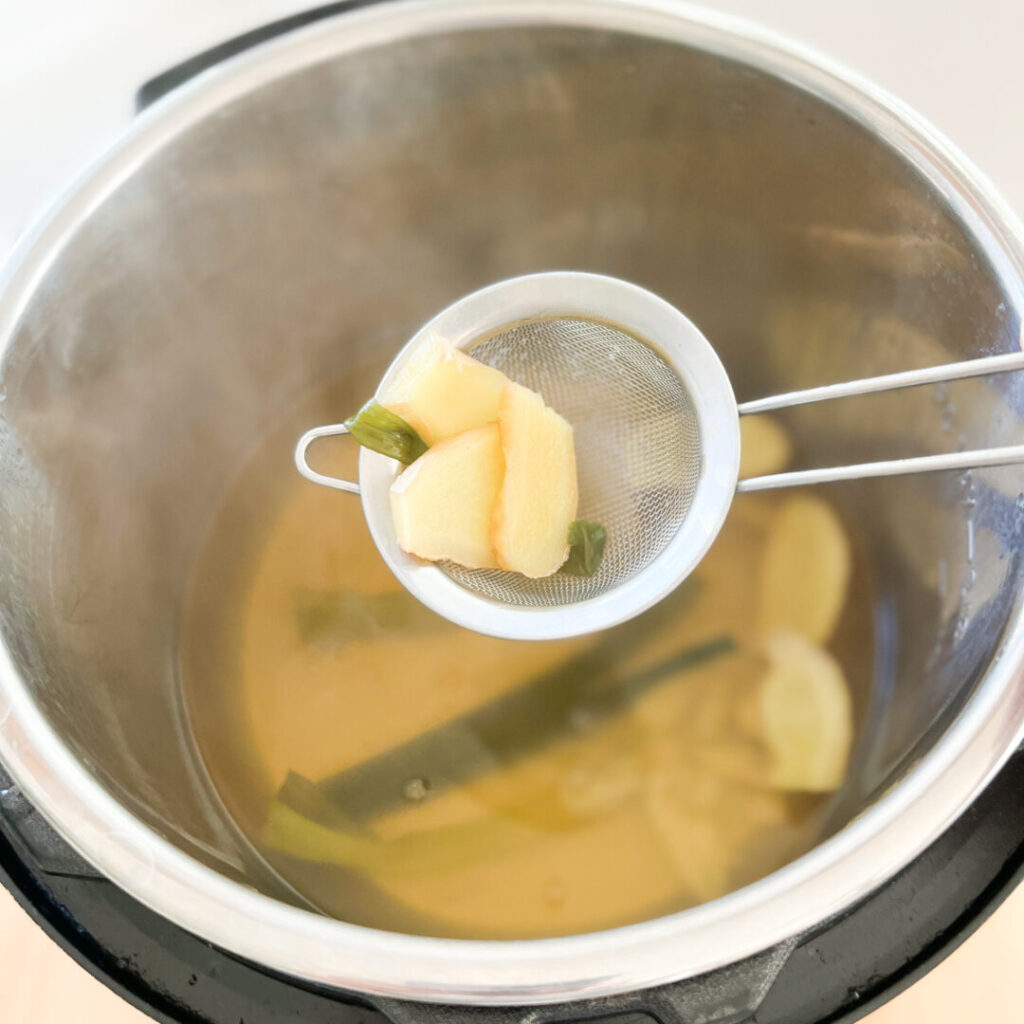 Scooping ingredients out of the stock.