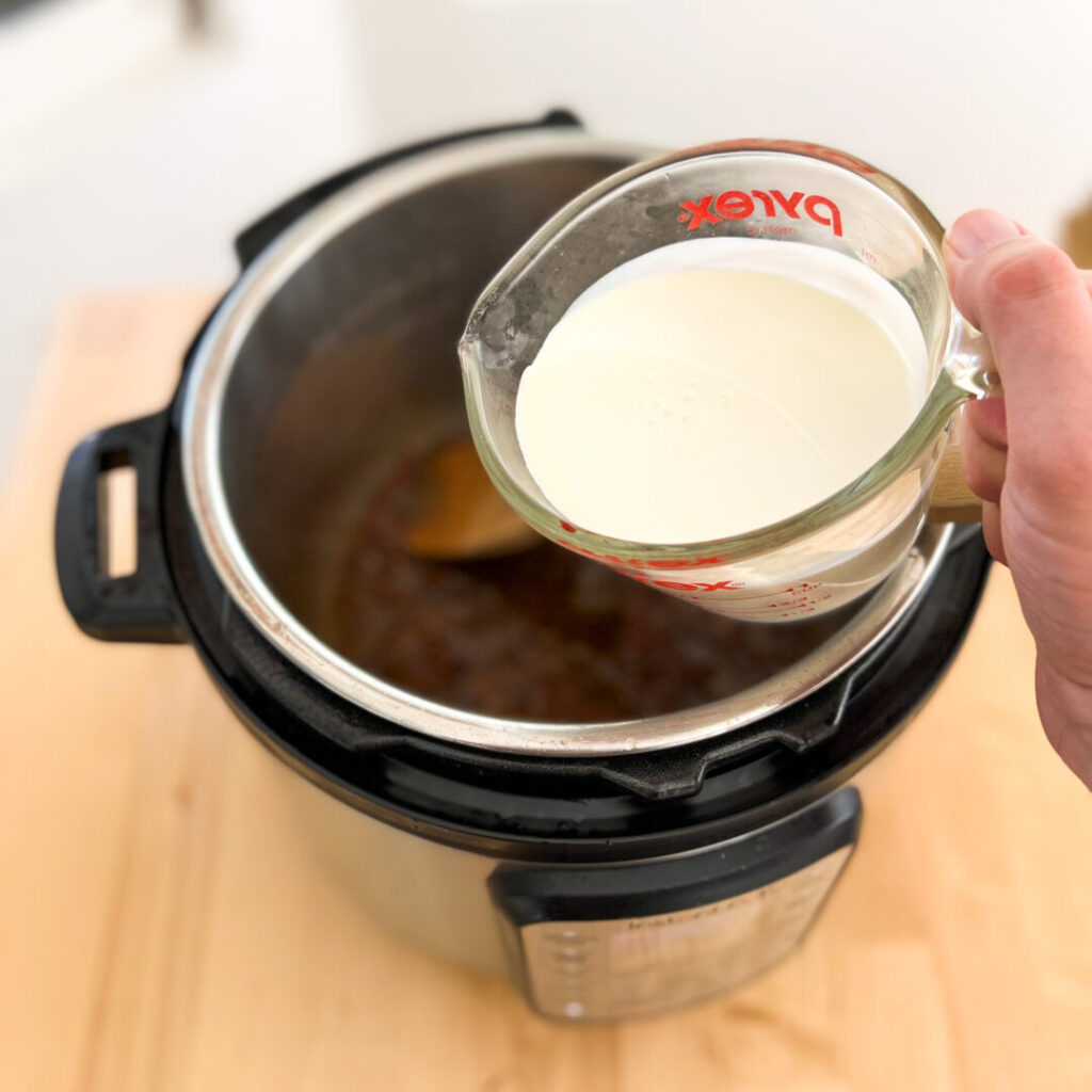 Adding cream to instant pot.